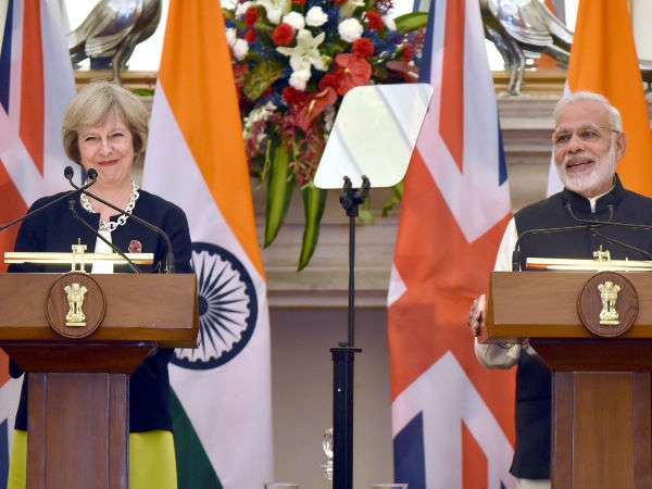 File photo of Theresa May with PM Modi File photo of Theresa May with PM Modi