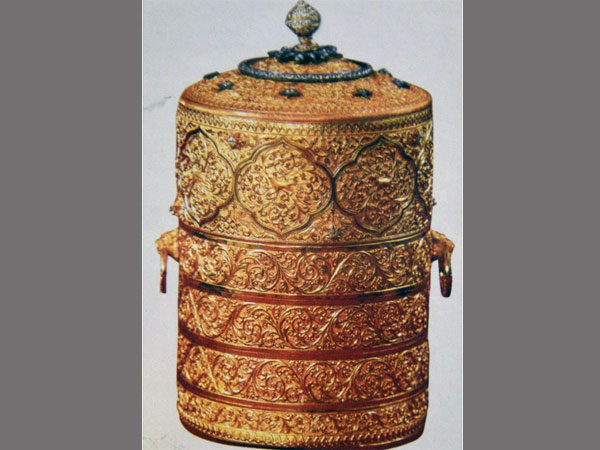 Gold tiffin box: Repository mainly of souvenirs