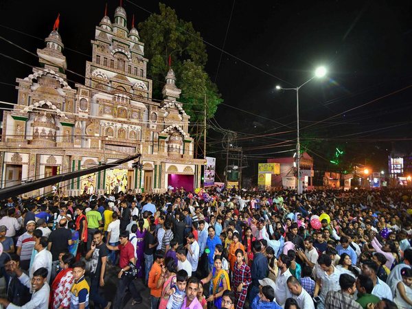 Devotees walk around the pandal Devotees walk around the pandal