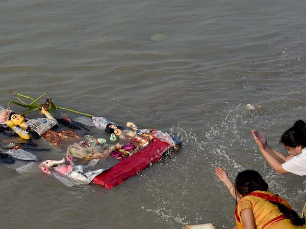 Protesters booked for raising anti-national slogans during Durga idol immersion Protesters booked for raising anti-national slogans during Durga idol immersion