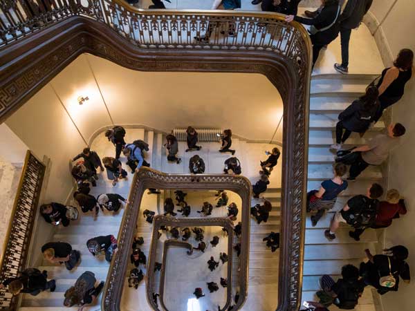 A large group of protesters against Brett Kavanaugh walk to offices of Sen. Jeff Flake, R-Ariz., on Capitol Hill in Washington