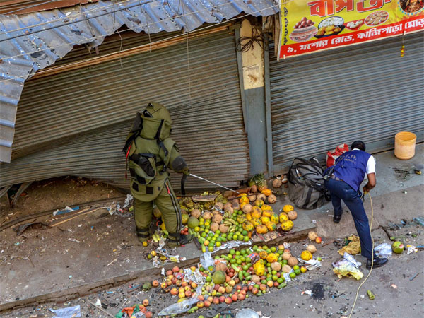 A bomb disposal squad member inspects the site of low intensity bomb blast at Kazipara, Nagerbazar area of Dumdum, in Kolkata A bomb disposal squad member inspects the site of low intensity bomb blast at Kazipara, Nagerbazar area of Dumdum, in Kolkata