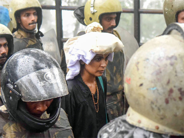 Activist Rehana Fathima being escorted by the police to Sabarimala Temple, Kerala Activist Rehana Fathima being escorted by the police to Sabarimala Temple, Kerala