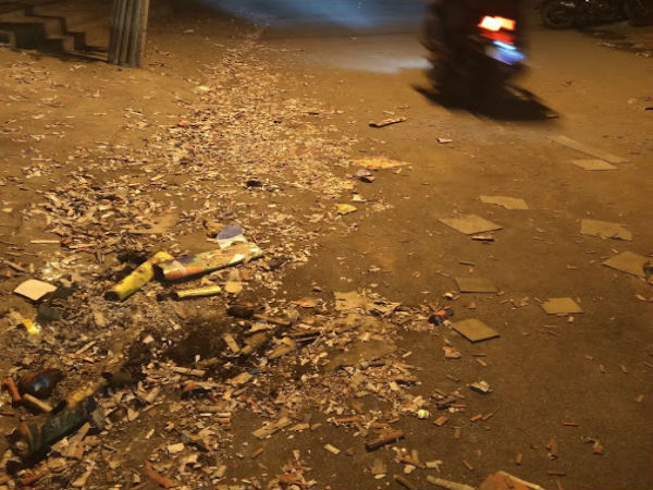 Firecracker waste layers roads, dust chokes lungs