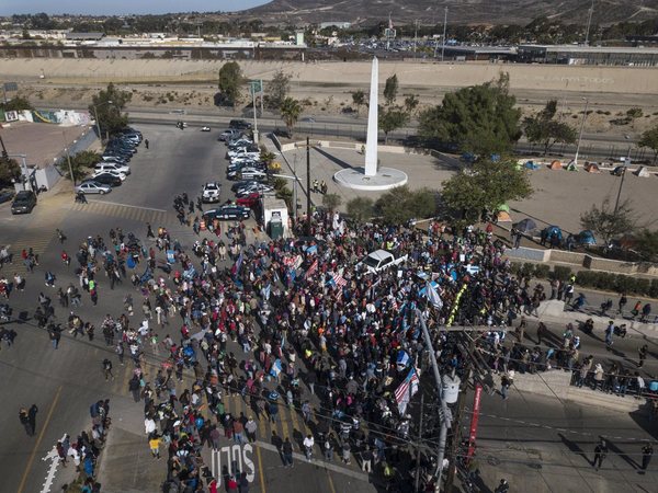 A group of migrants gathered at the Chaparral border crossing in Tijuana, Mexico