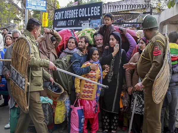 Policemen man the stranded passengers as wait for their turns to be taken to the airport for their subsequent airlifting by IAF planes for Srinagar, in Jammu, Monday, Feb 11, 2019. (PTI Photo) Policemen man the stranded passengers as wait for their turns to be taken to the airport for their subsequent airlifting by IAF planes for Srinagar, in Jammu, Monday, Feb 11, 2019. (PTI Photo)