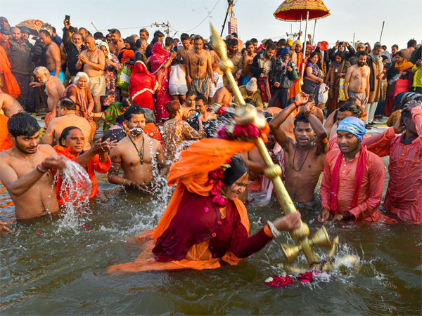 Devotees take a holy dip at Sangam during Makar Sankranti