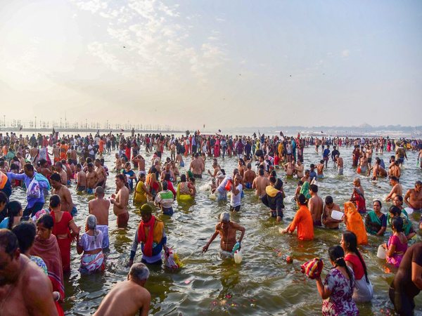 Devotees take a holy dip at Sangam on the occasion of 'Maghi Purnima'