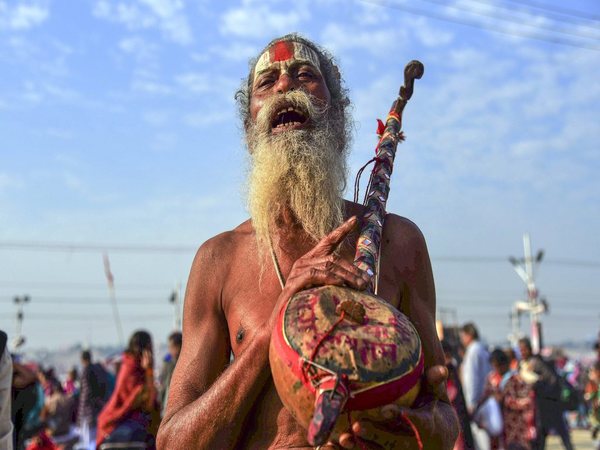 A sadhu chants hymns after taking a holy dip at Sangam