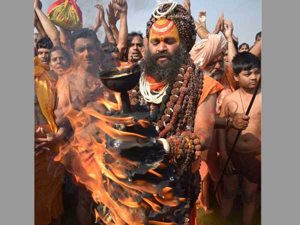 A sadhu offering prayers at Sangam on the auspicious 'Maghi Purnima'