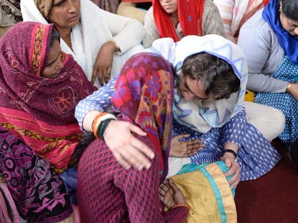 Priyanka Gandhi consoling family members Priyanka Gandhi consoling family members
