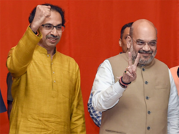 BJP President Amit Shah flanked by Shiv Sena President Uddhav Thackeray during the announcement of an alliance between Shiv Sena and BJP for Lok Sabha and Assembly polls, in Mumbai BJP President Amit Shah flanked by Shiv Sena President Uddhav Thackeray during the announcement of an alliance between Shiv Sena and BJP for Lok Sabha and Assembly polls, in Mumbai