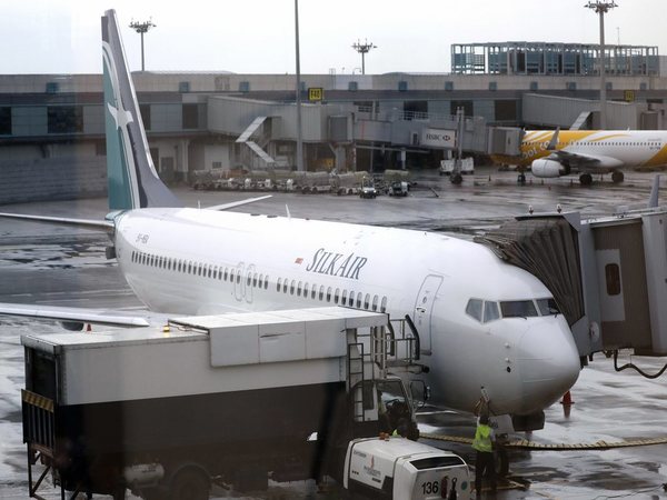 In this Oct. 4, 2017, file photo, SilkAirs new Boeing 737 Max 8 aircraft is seen through a viewing gallery window parked on the tarmac of Singapores Changi International Airport. PTI file photo In this Oct. 4, 2017, file photo, SilkAirs new Boeing 737 Max 8 aircraft is seen through a viewing gallery window parked on the tarmac of Singapores Changi International Airport. PTI file photo