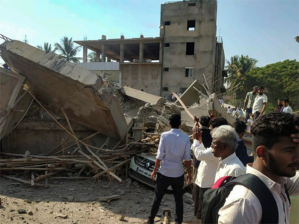 Rescue officials and locals carry out search and rescue operation after a multistorey building collapsed in Dharwad, Karnataka Rescue officials and locals carry out search and rescue operation after a multistorey building collapsed in Dharwad, Karnataka
