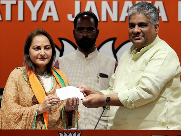 Bharatiya Janata Party General Secretary Bhupender Yadav presents the membership slip to veteran actor and former MP Jaya Prada as she joins BJP, in New Delhi Bharatiya Janata Party General Secretary Bhupender Yadav presents the membership slip to veteran actor and former MP Jaya Prada as she joins BJP, in New Delhi