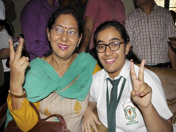 Hansika Shukla, CBSE class 12th topper, poses for a photograph with her mother after the results were declared Hansika Shukla, CBSE class 12th topper, poses for a photograph with her mother after the results were declared
