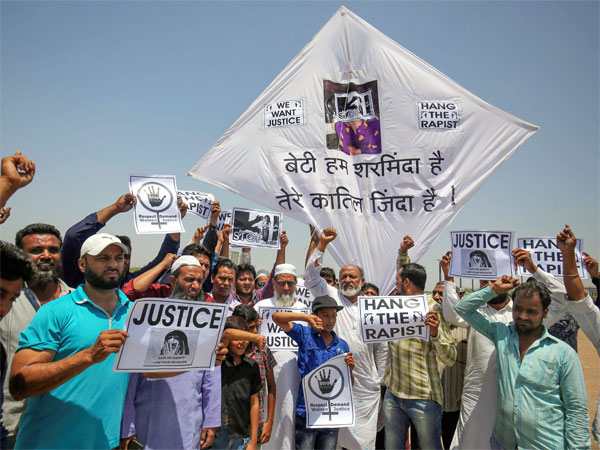 People display kites and placard during a protest against Kathua case. Photo credit: PTI People display kites and placard during a protest against Kathua case. Photo credit: PTI