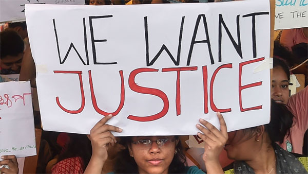 Junior doctors hold placards during a demonstration after an intern doctor was attacked and seriously injured over the death of a 75-year-old patient, at Nil Ratan Sircar Medical College and Hospital, in Kolkata Junior doctors hold placards during a demonstration after an intern doctor was attacked and seriously injured over the death of a 75-year-old patient, at Nil Ratan Sircar Medical College and Hospital, in Kolkata