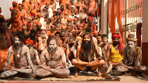 Sadhus perform yoga