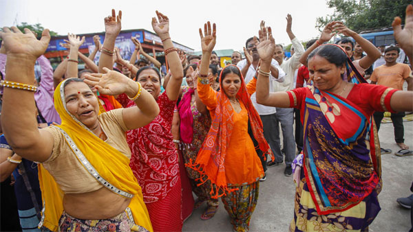 Pilgrims dance and chant religious slogans after the Amarnath Yatra was suspended Pilgrims dance and chant religious slogans after the Amarnath Yatra was suspended