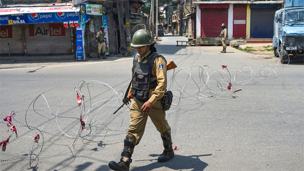 CRPF personnel stand guard during a strike called by separatist leaders on the third death anniversary of Hizbul Mujahideen militant commander Burhan Wani, in Srinagar CRPF personnel stand guard during a strike called by separatist leaders on the third death anniversary of Hizbul Mujahideen militant commander Burhan Wani, in Srinagar