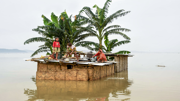 A family marooned on the top of a hut in the flood-hit locality A family marooned on the top of a hut in the flood-hit locality