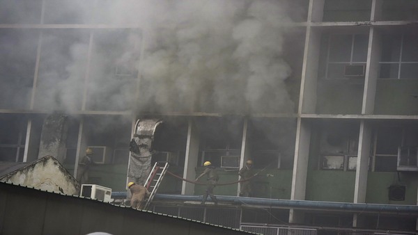 Fire brigade pesonnel fighting blaze which broke out at the teaching block