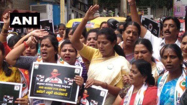 Karnataka Mahila Congress workers protest against Deputy Chief Minister of the state Laxman Savadi Karnataka Mahila Congress workers protest against Deputy Chief Minister of the state Laxman Savadi