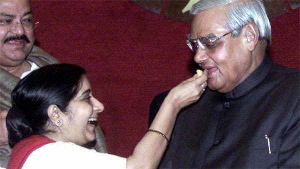 Sushma offers sweet to Vajpayee