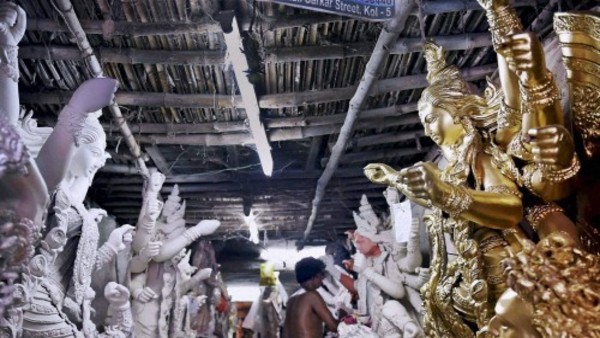 Durga idol making process of eye painting:
