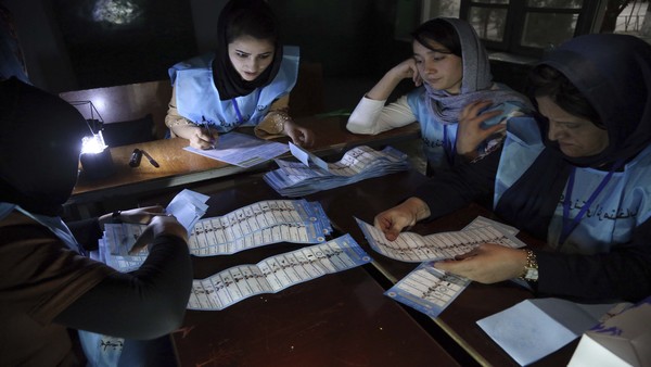 Afghan election workers count ballots during the presidential elections, at a polling station in Kabul Afghan election workers count ballots during the presidential elections, at a polling station in Kabul