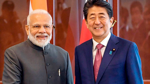PM Modi meets Japanese PM Shinzo Abe in Russia PM Modi meets Japanese PM Shinzo Abe in Russia