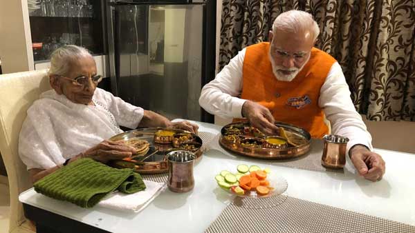 In the image, PM Modi is seen having birthday lunch with his mother