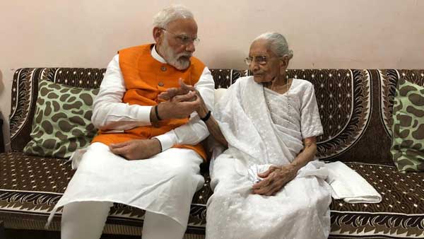 PM Modi with his mother Heeraben Modi at her Gandhinagar residence