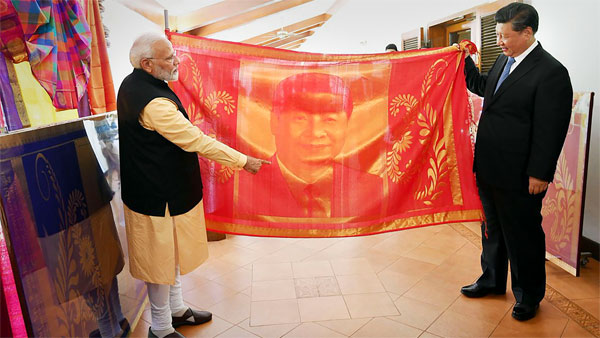 The magnificent portrait is made using pure mulberry silk and gold thread (zari).