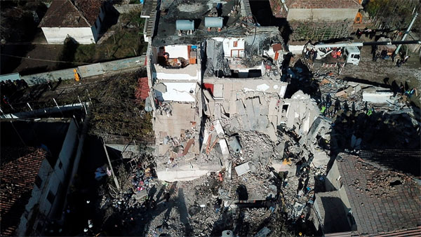 Rescuers search at a damaged building after a magnitude 6.4 earthquake in Thumane, western Albania Rescuers search at a damaged building after a magnitude 6.4 earthquake in Thumane, western Albania