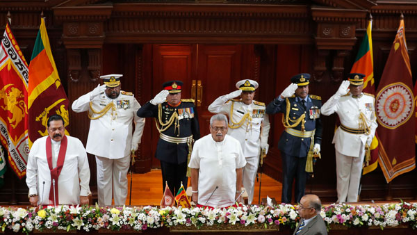 Sri Lankan President Gotabaya Rajapaksa, front right, and his brother and the countrys new Prime Minister Mahinda Rajapaksa Sri Lankan President Gotabaya Rajapaksa, front right, and his brother and the countrys new Prime Minister Mahinda Rajapaksa
