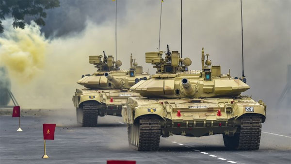 Jawans drive a battle tank during the rehearsal: