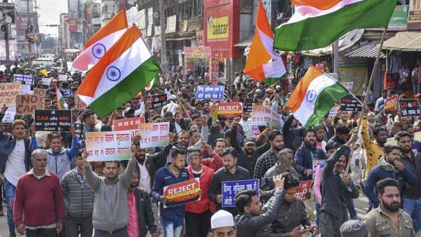 Protesters in Ranchi carrying the triclour display placards: