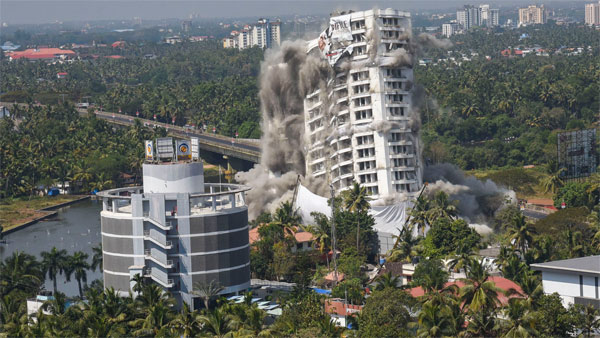 A view of Holy Faith H20, a water-front complex, being demolished using controlled implosion at Maradu in Kochi A view of Holy Faith H20, a water-front complex, being demolished using controlled implosion at Maradu in Kochi
