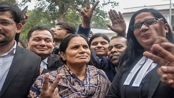 Nirbhaya’s parents outside the Patiala House Courts in Delhi