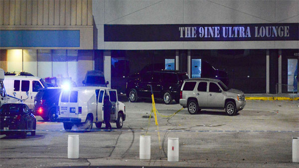 Kansas City, Mo., police crime scene investigators gather evidence at the scene of a shooting at a nightclub Kansas City, Mo., police crime scene investigators gather evidence at the scene of a shooting at a nightclub