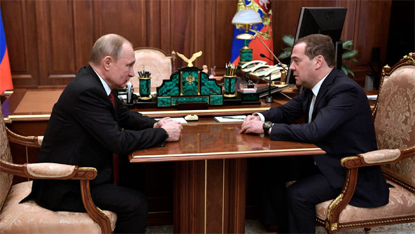Russian President Vladimir Putin and Dmitry Medvedev Russian President Vladimir Putin and Dmitry Medvedev