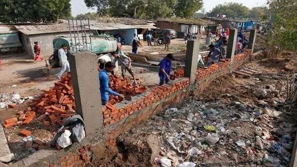 Donald Trump in India: After wall erection, slum residents slapped with eviction notice Donald Trump in India: After wall erection, slum residents slapped with eviction notice