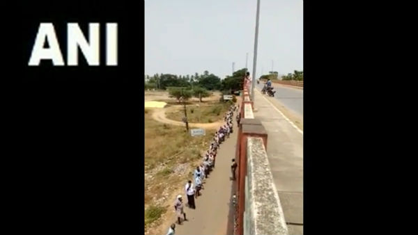 Watch: Long queue outside a liquor shop in Andhra Pradesh Watch: Long queue outside a liquor shop in Andhra Pradesh