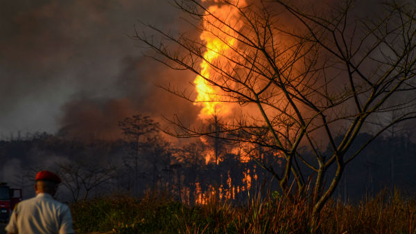 Massive fire rages at Assam oil well, Air Force on standby Massive fire rages at Assam oil well, Air Force on standby