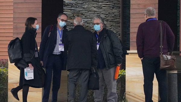 Members of the World Health Organization team chat after returning to their hotel in Wuhan in central Chinas Hubei province Members of the World Health Organization team chat after returning to their hotel in Wuhan in central Chinas Hubei province