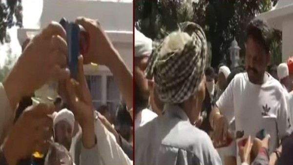 Covid norms go for a toss as Devotees make beeline to offer liquor as Prasad at Baba Rode Shah shrine Covid norms go for a toss as Devotees make beeline to offer liquor as Prasad at Baba Rode Shah shrine