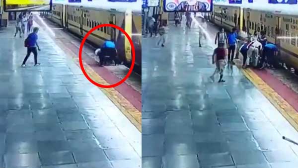 WATCH: Alert passenger saves Indore woman from falling under train while boarding moving train in MP WATCH: Alert passenger saves Indore woman from falling under train while boarding moving train in MP