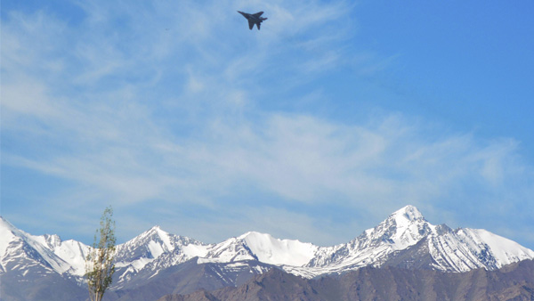 A fighter jet flies from Indian Air force base in the backdrop of a Himalayan mountain range, amid border tensions with China, in Leh A fighter jet flies from Indian Air force base in the backdrop of a Himalayan mountain range, amid border tensions with China, in Leh